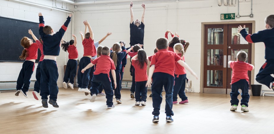 Image: Children jumping with dance teacher - Ballet Ireland