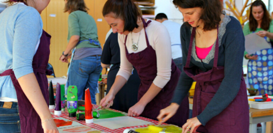 Women Teachers at a table painting