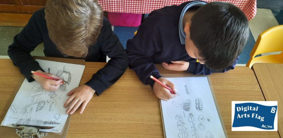 Branar's Acorn Digital Arts Flag - image with two pupils drawing at a desk.