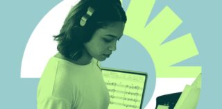 Image of student wearing headphone and using music technology for UCD Composition Prize