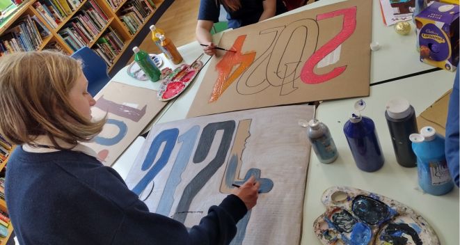 Students from Marino College working on Parade props