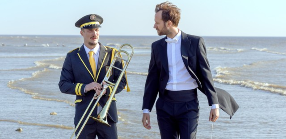 Two musicians on a beach for The Marching Band (En Fanfare) Schools screening at Cork Film Festival