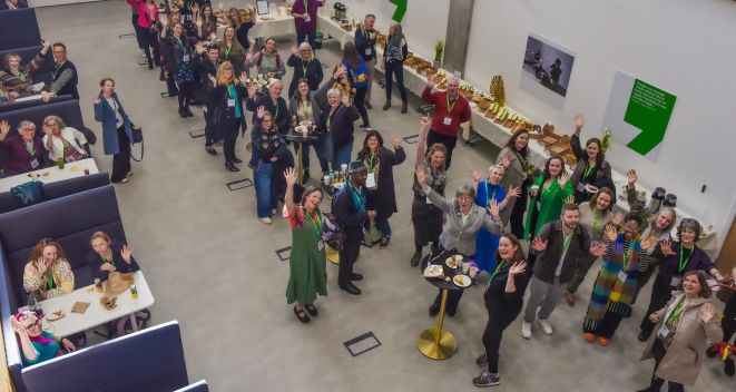 Delegates at National Arts in Education Portal Day in TU Dublin wave up at the camera