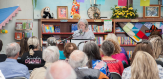 Woman reading for audience at West Cork Literary Festival