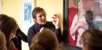 People chatting about an artwork for Frameworks programme