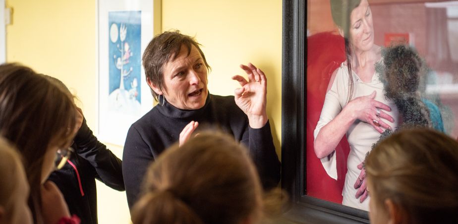 People chatting about an artwork for Frameworks programme