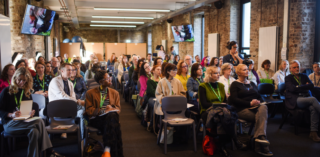 People sitting in a conference room - Kids' Own are hiring for a Portal Project Manager