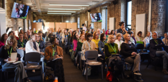 People sitting in a conference room - Kids' Own are hiring for a Portal Project Manager