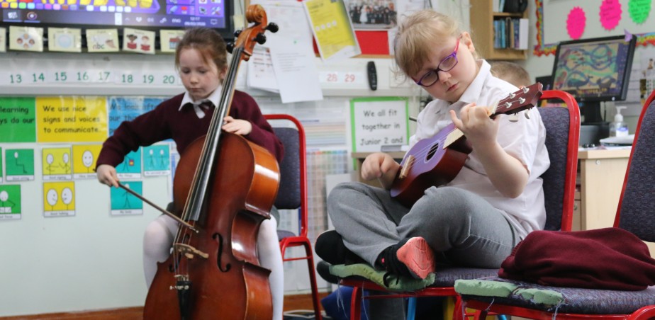 Practicing and recording the score for 'The Lonely Traveller' written by the class. 